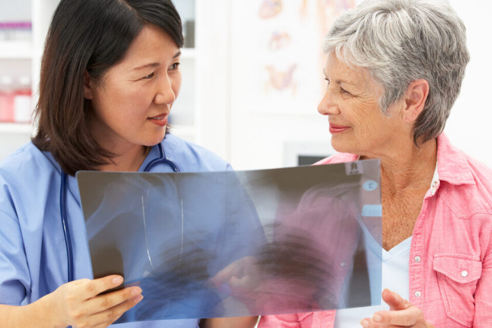 Doctor and patient looking at lung x-ray