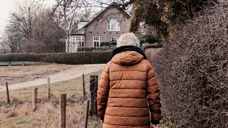 Lady walking in cold autumn with a coat